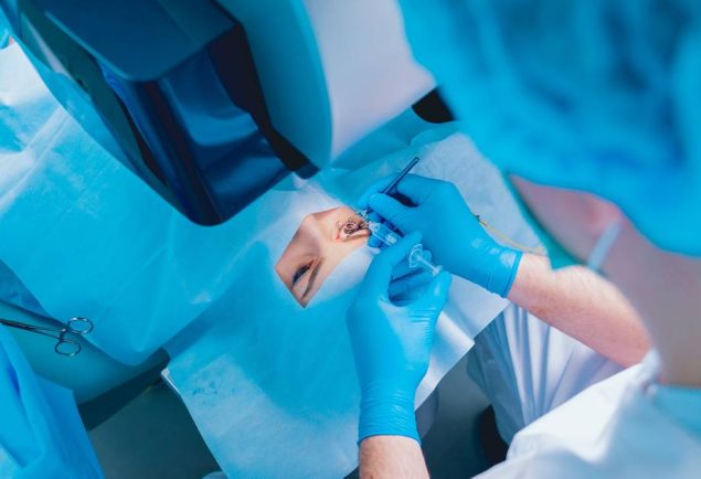 laser-vision-correction-patient-and-team-of-surgeons-in-the-operating-room-during-ophthalmic-surgery-eyelid-speculum-lasik-treatment